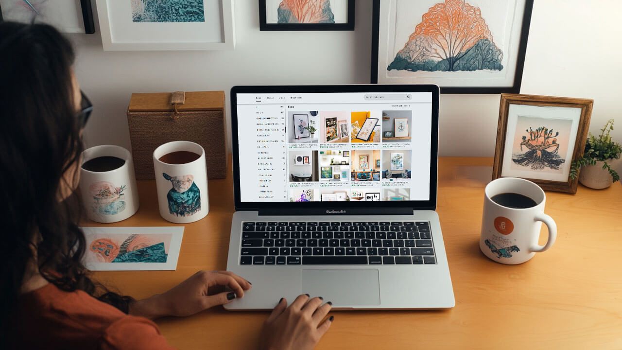 woman browsing Etsy on laptop