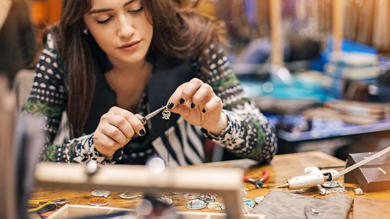 Craftsperson making and listing on Etsy