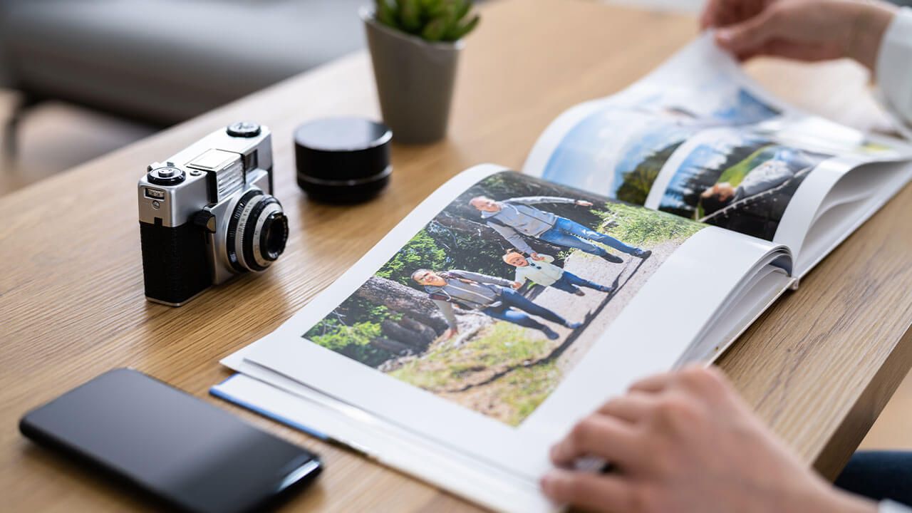Printed photo book on table