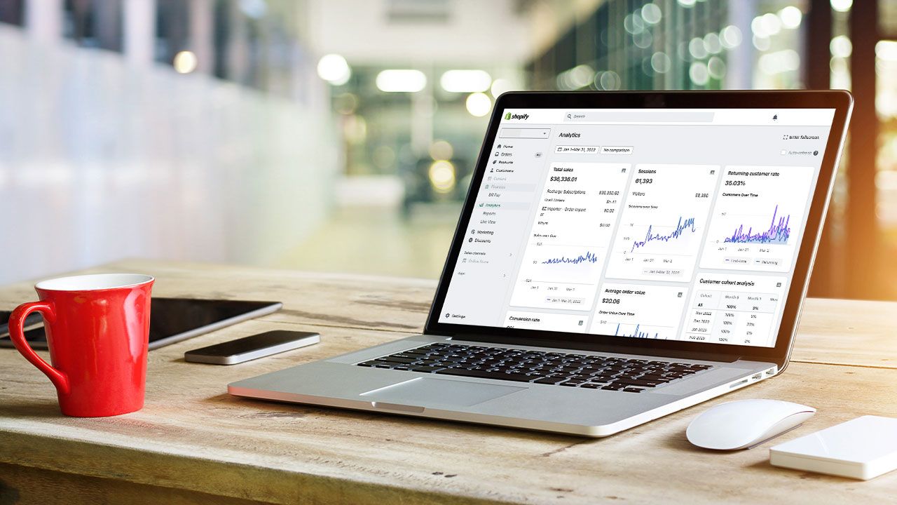 Laptop showing Shopify dashboard