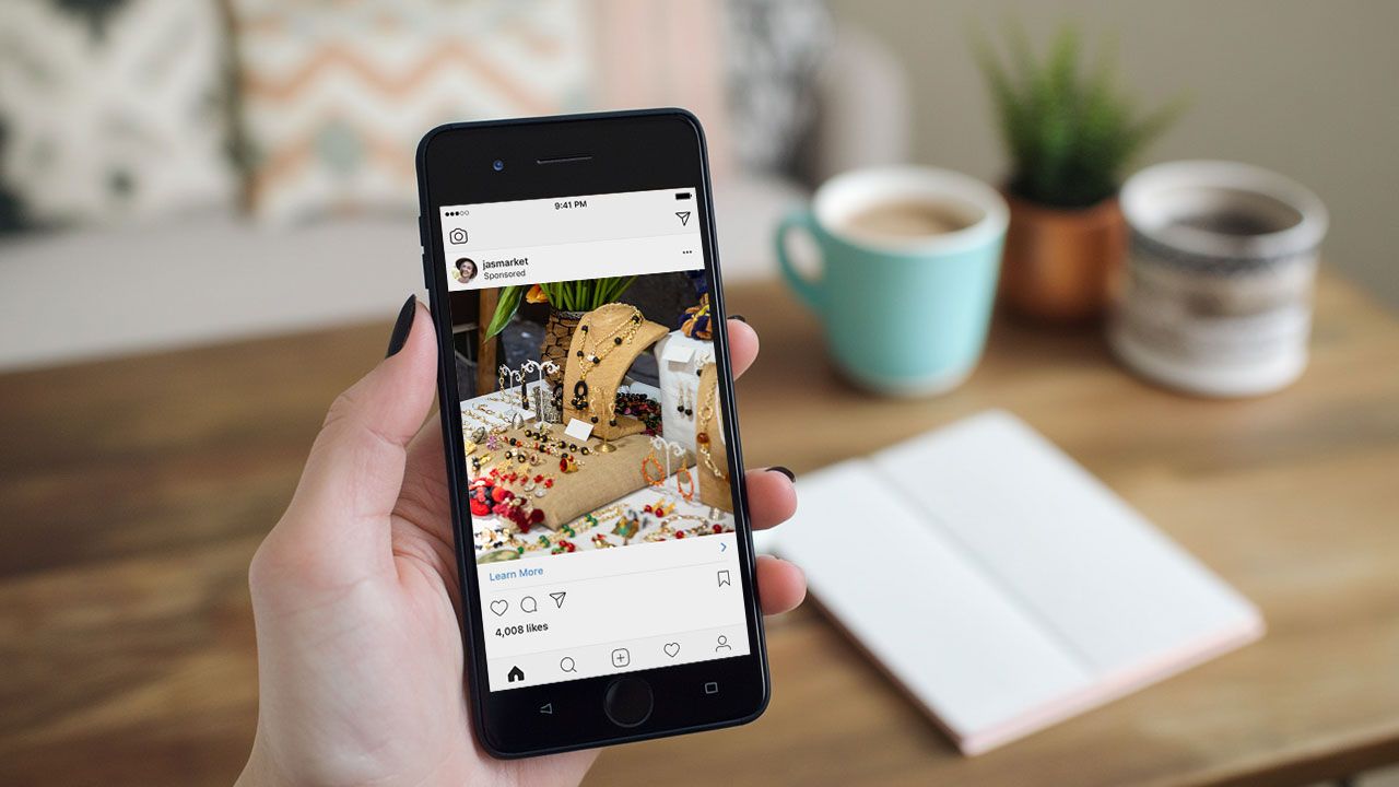 Person sharing Etsy shop on phone