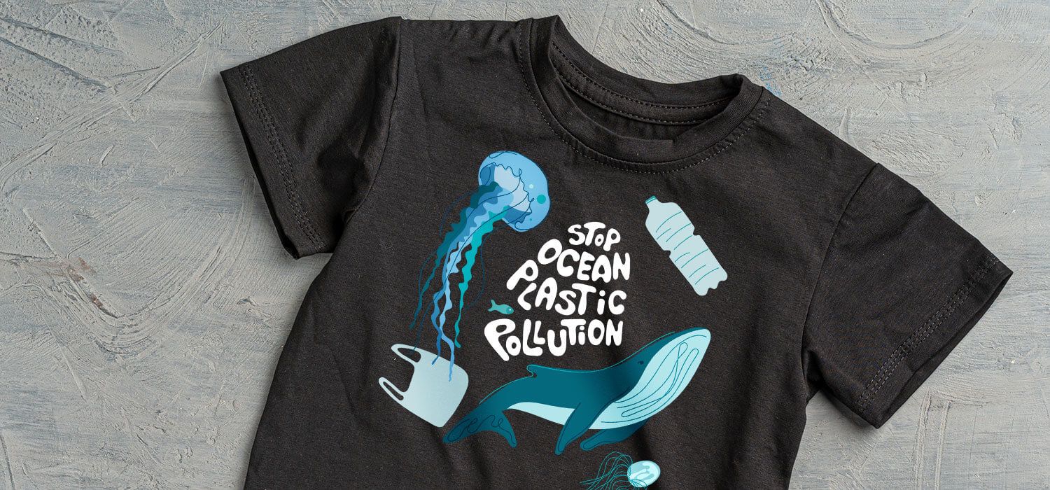 Black T-shirt with "Stop Ocean Plastic Pollution" text, featuring illustrations of a jellyfish, plastic bottle, bag, and a whale.