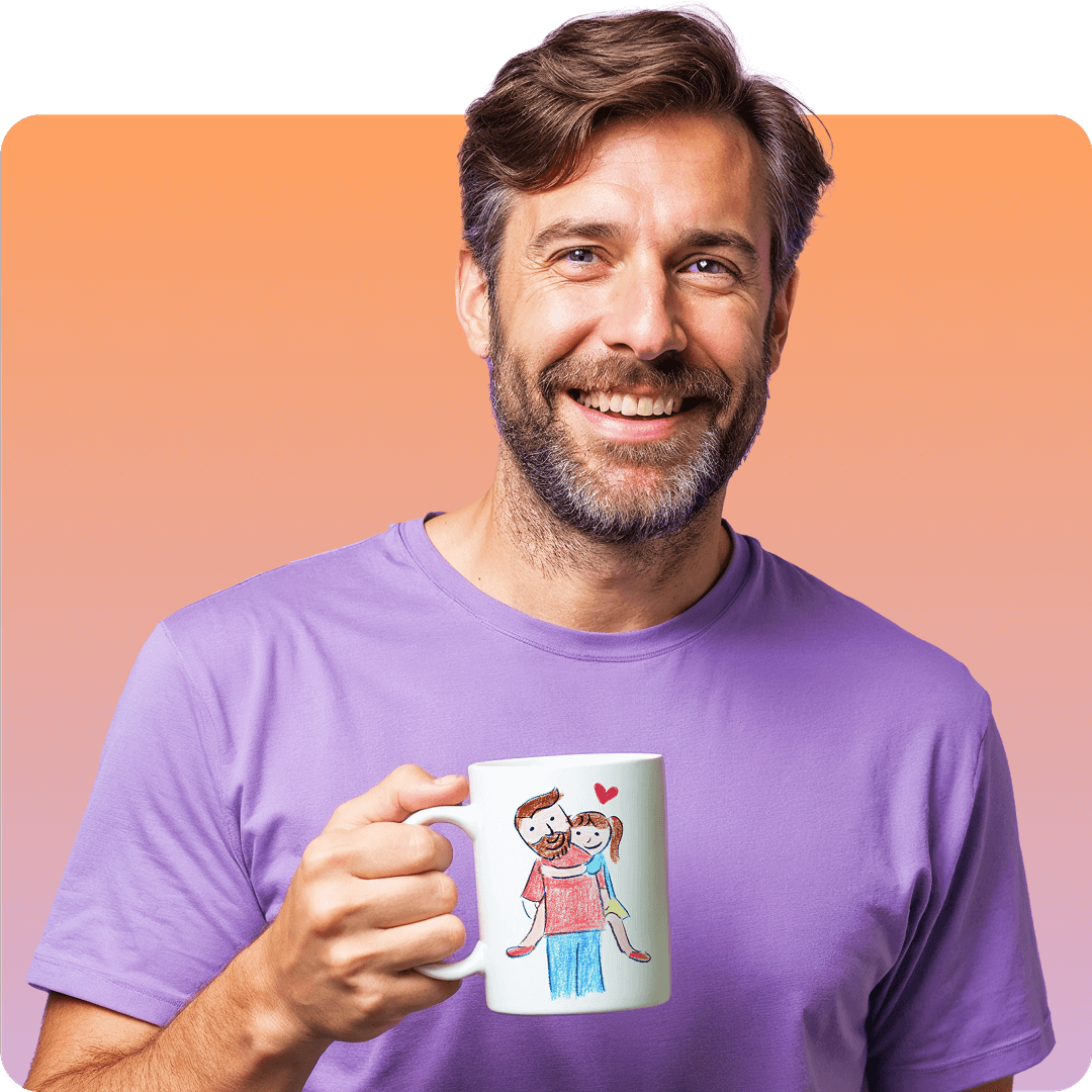 Smiling man in a purple shirt holds a mug with a childlike drawing of a couple and a heart on an orange gradient background.