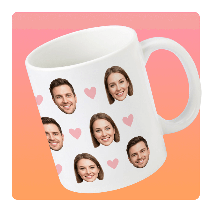 White mug covered in repeating smiling male and female faces and pink hearts against a peach-pink gradient background.